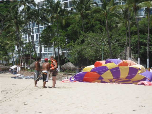 jess getting hooked up for parasailing